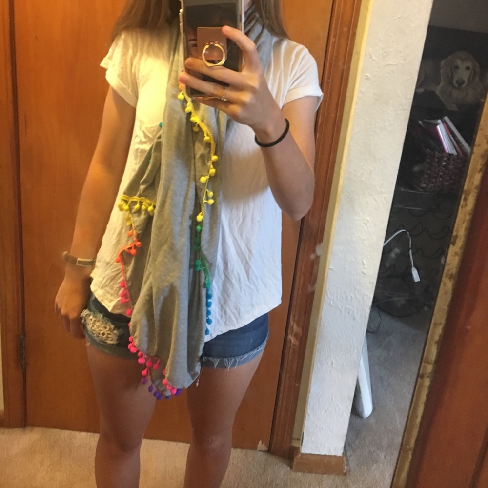Grey scarf with rainbow ball yarn lining